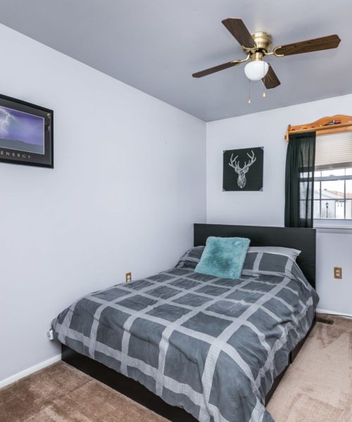 90 King Charles Circle bedroom with ceiling fan