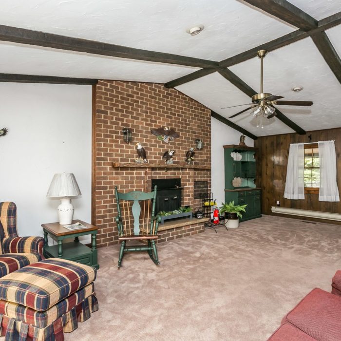 201 Janet Ct. den with ceiling fan, exposed beams