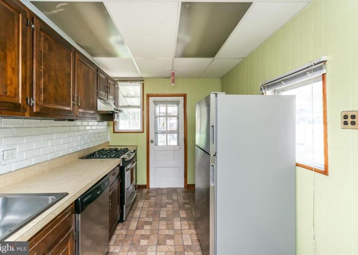 316 Drew St., kitchen with cabinets and back door
