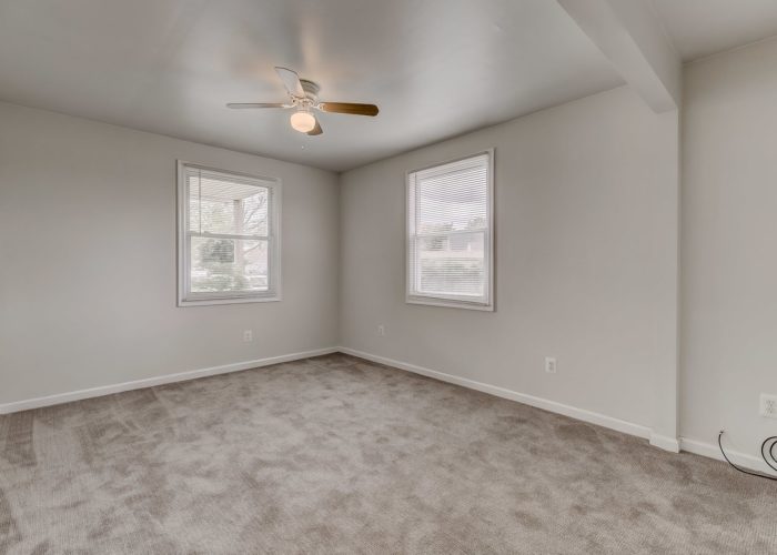 8134 Bullneck Road, gray carpet and ceiling fan in bedroom
