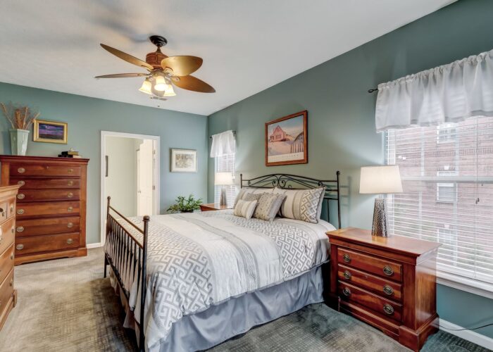 9505 Kingscroft Terrace #M, owner's suite bedroom with windows and ceiling fan