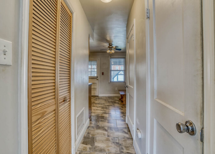 1904 Searles Rd., hallway with door shut to washer and dryer