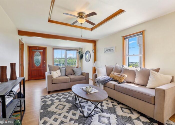 7312 Bay Front Road, living room with ceiling fan