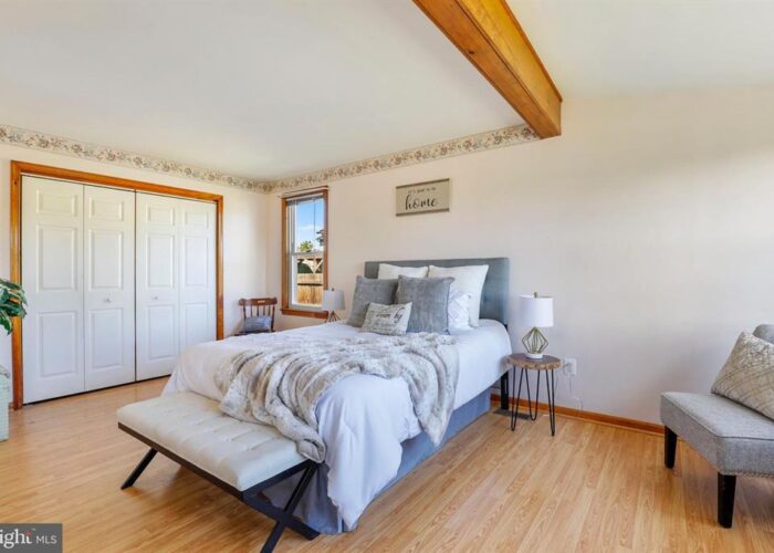 7312 Bay Front Road, primary bedroom with exposed beam
