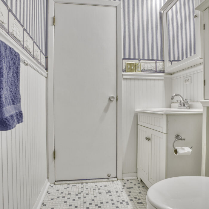 2502 Lampost Lane, bathroom with striped walls