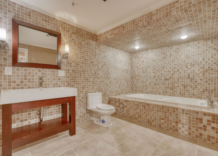 4900 Villa Point, tiles floor and walls in lower level bathroom