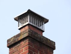 A chimney with a chimney cap, one of the 4 parts to check before listing your home.