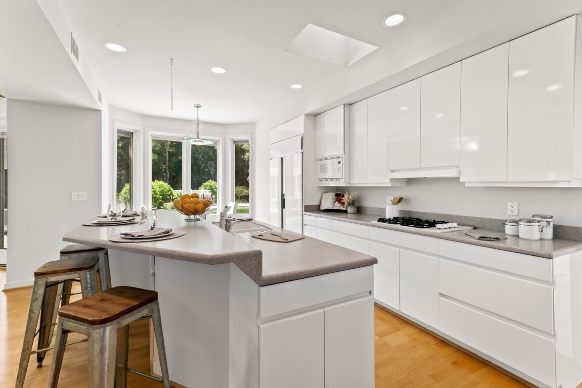 11324 Cedar Lane, kitchen with white cabinets.