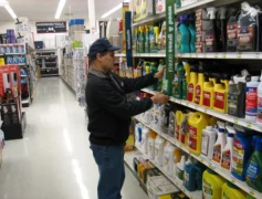 Choosing a pesticide and reading the labels in the store.