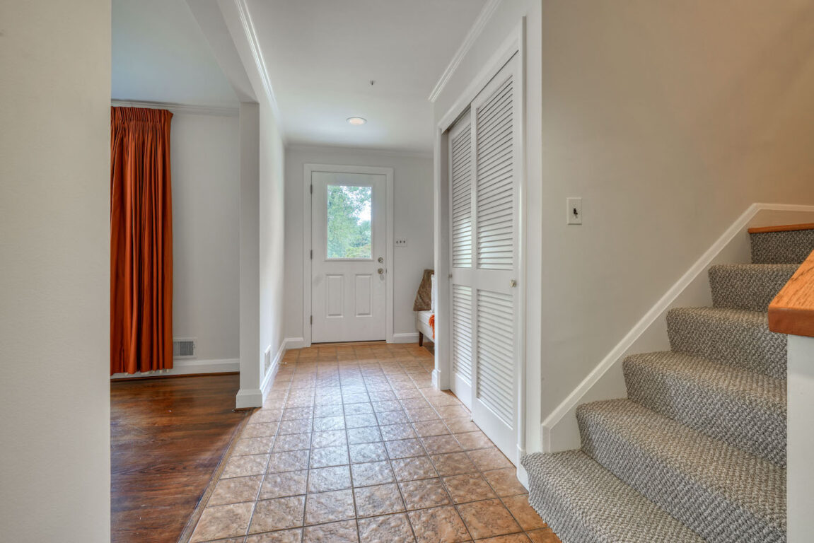 31 Millstone Road, entryway with closet and stairs leading up.