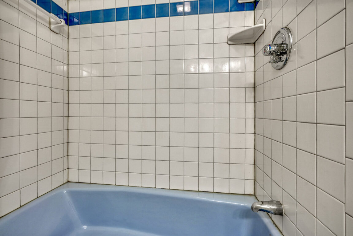 31 Millstone Road, white bathroom with blue tub.