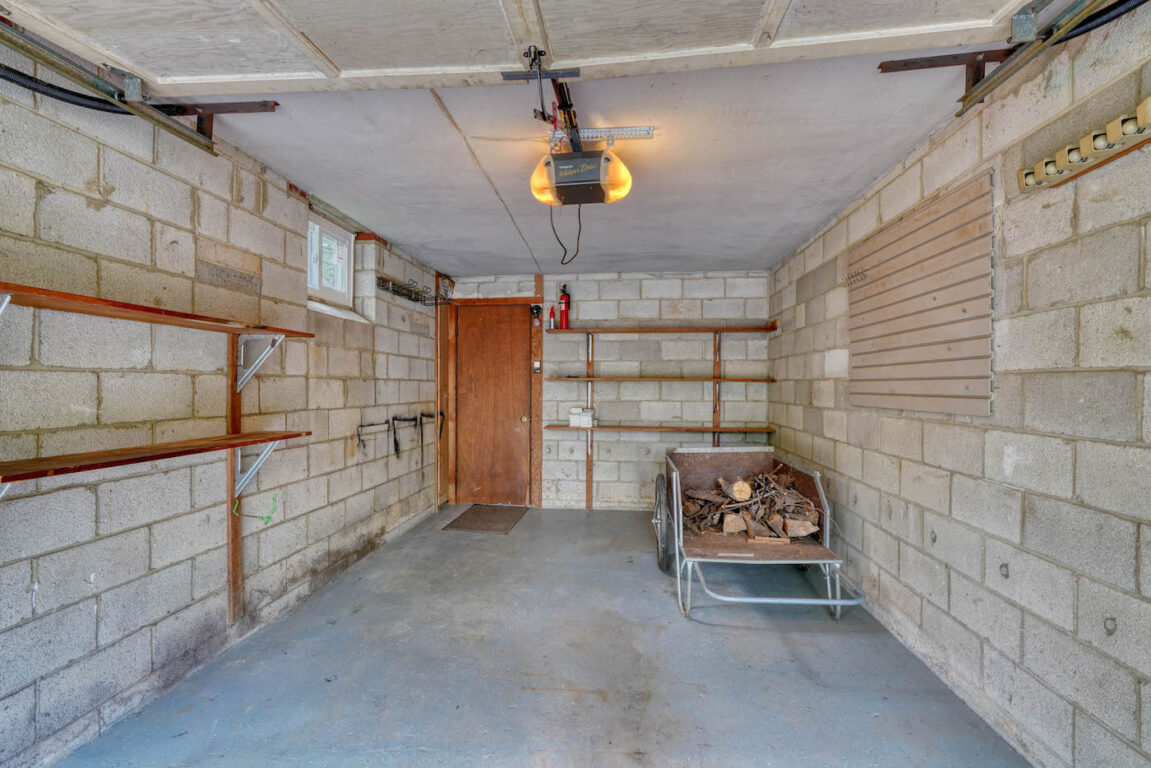 31 Millstone Road, garage with lots of shelving.