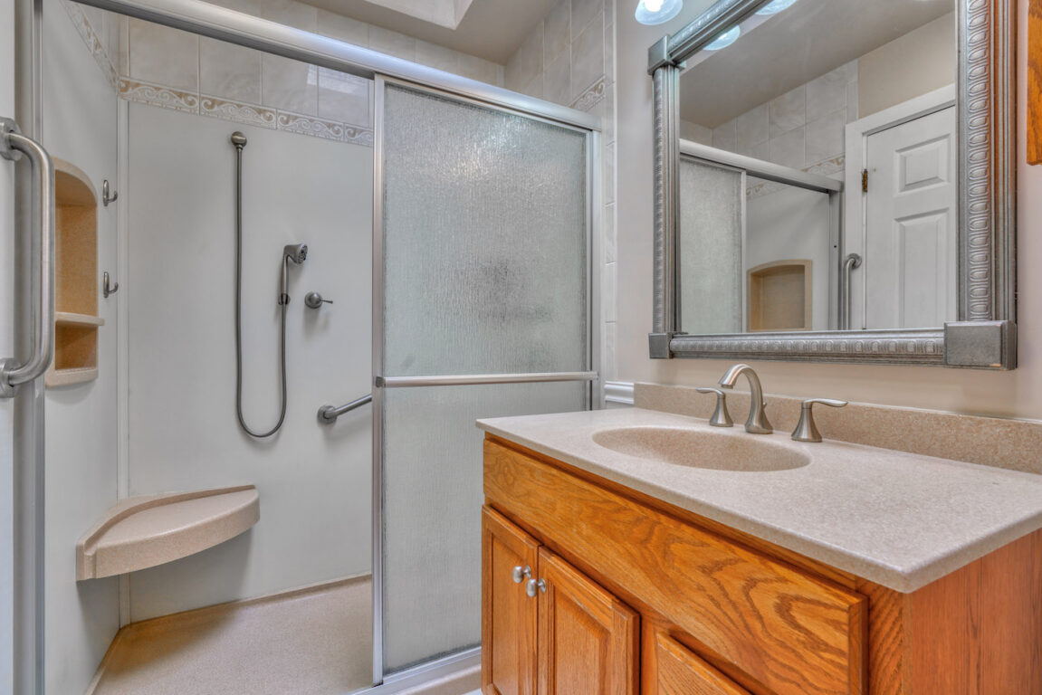 7512 Riddle Avenue, full bathroom with handicap attachments.