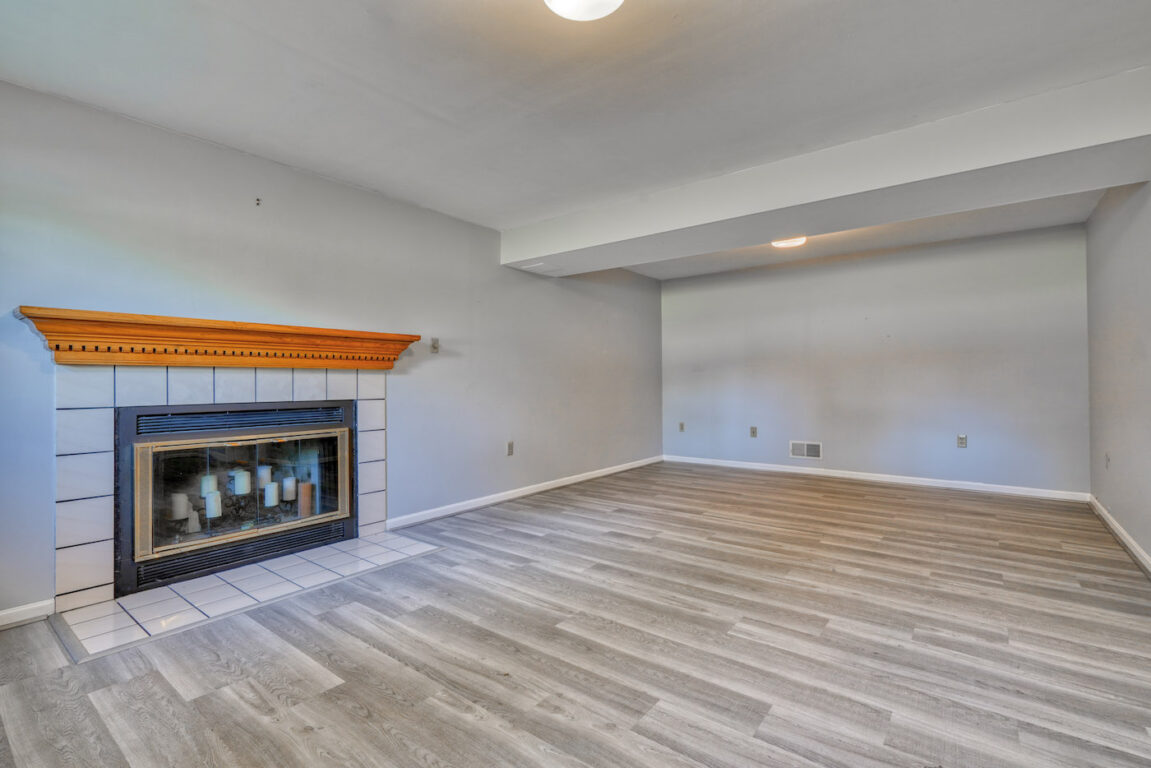 7512 Riddle Avenue, lower level family room with fireplace.