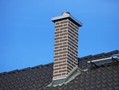 A chimney on the roof of a home.