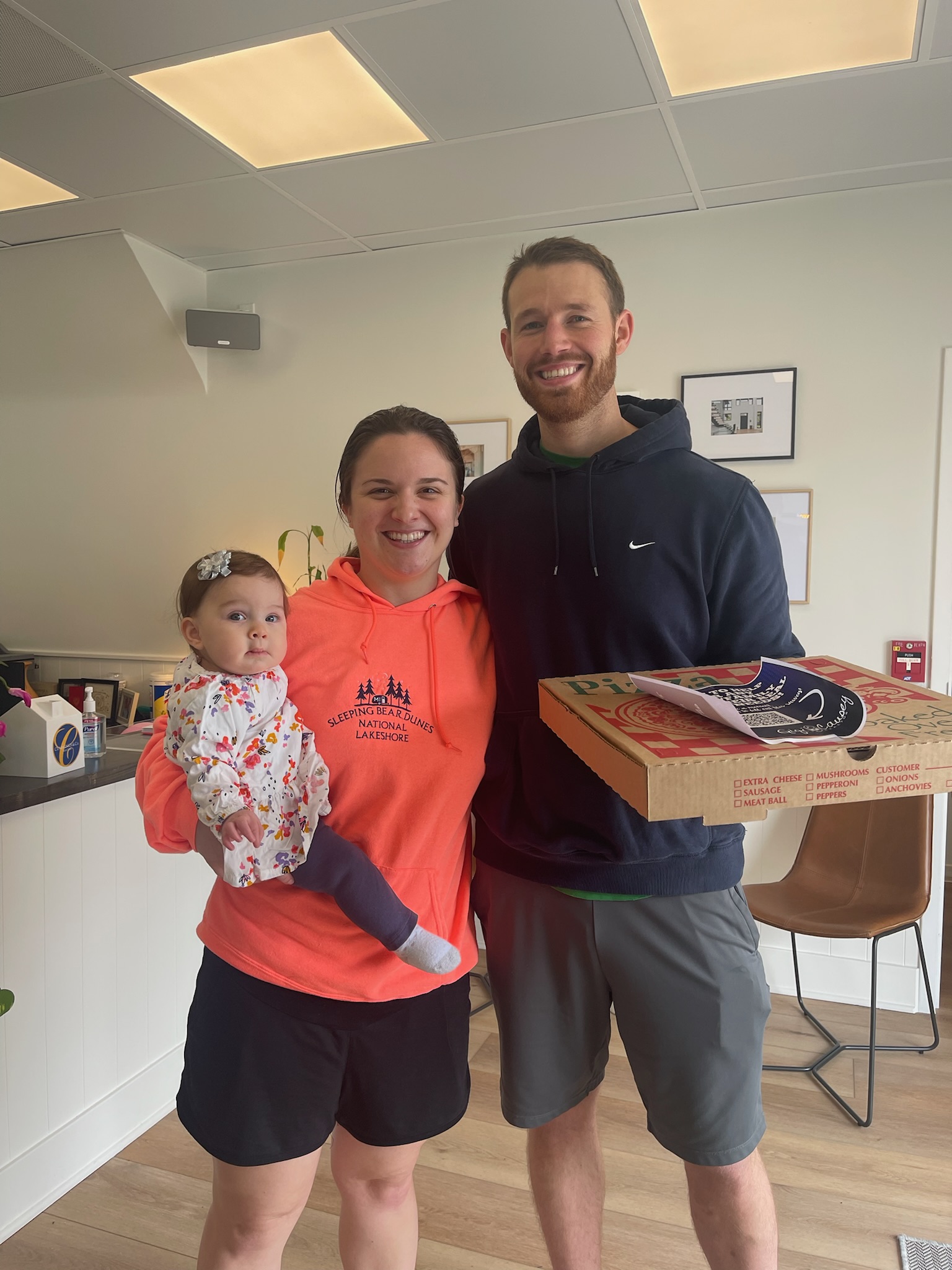 lovely family picking up a pizza