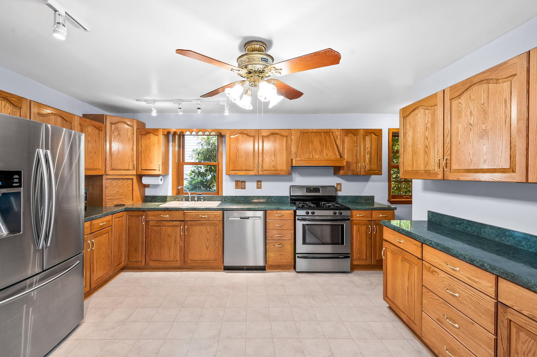 1246 S 48th St, kitchen with track lighting and ceiling fan with 4 lights.